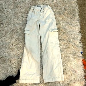Cream baggy jeans.